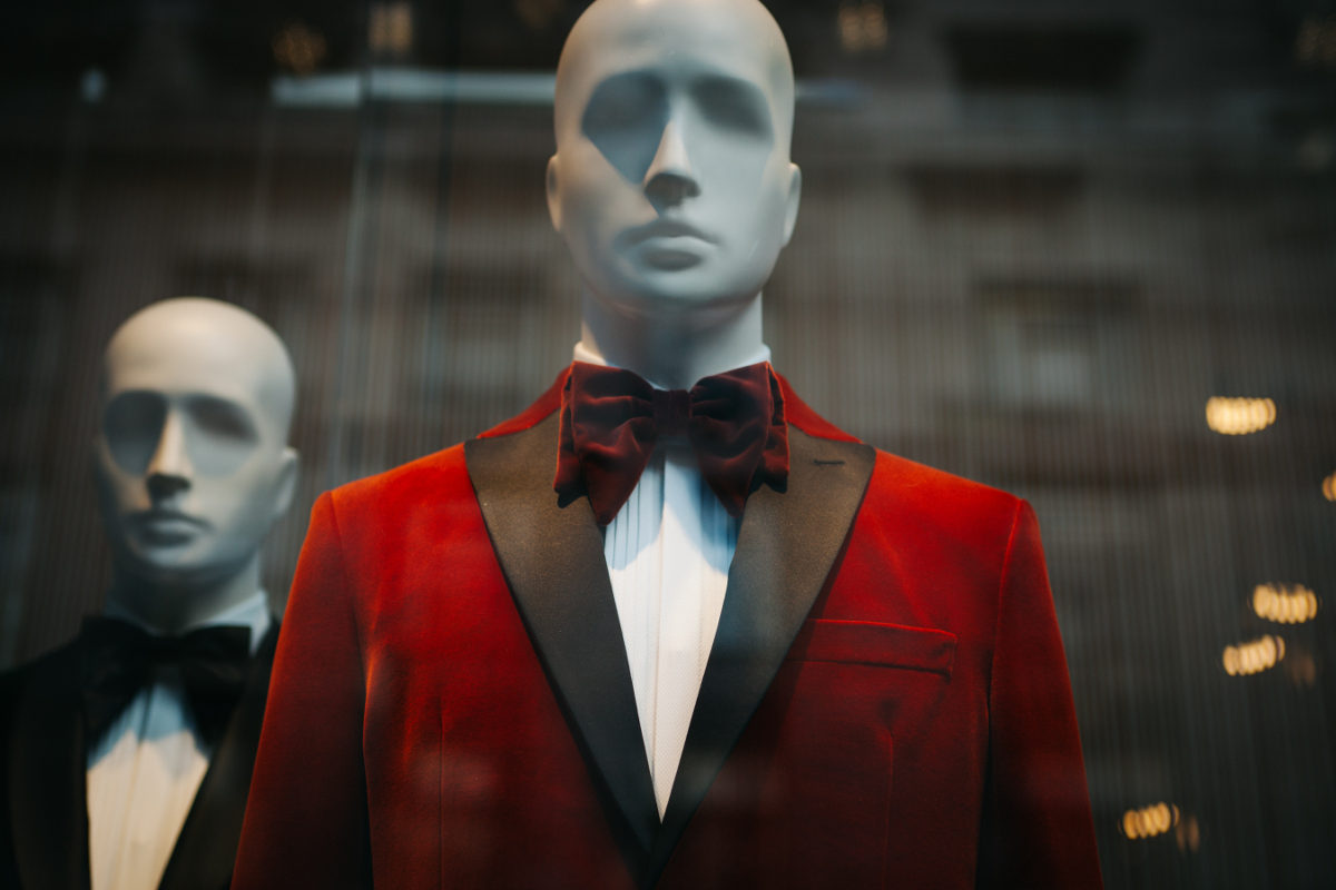 Mannequin wearing burgundy smoking jacket and bow tie