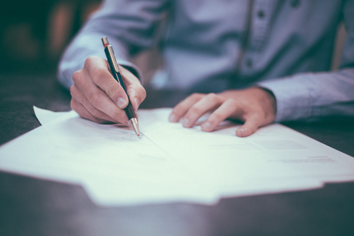 Man on a desk writing