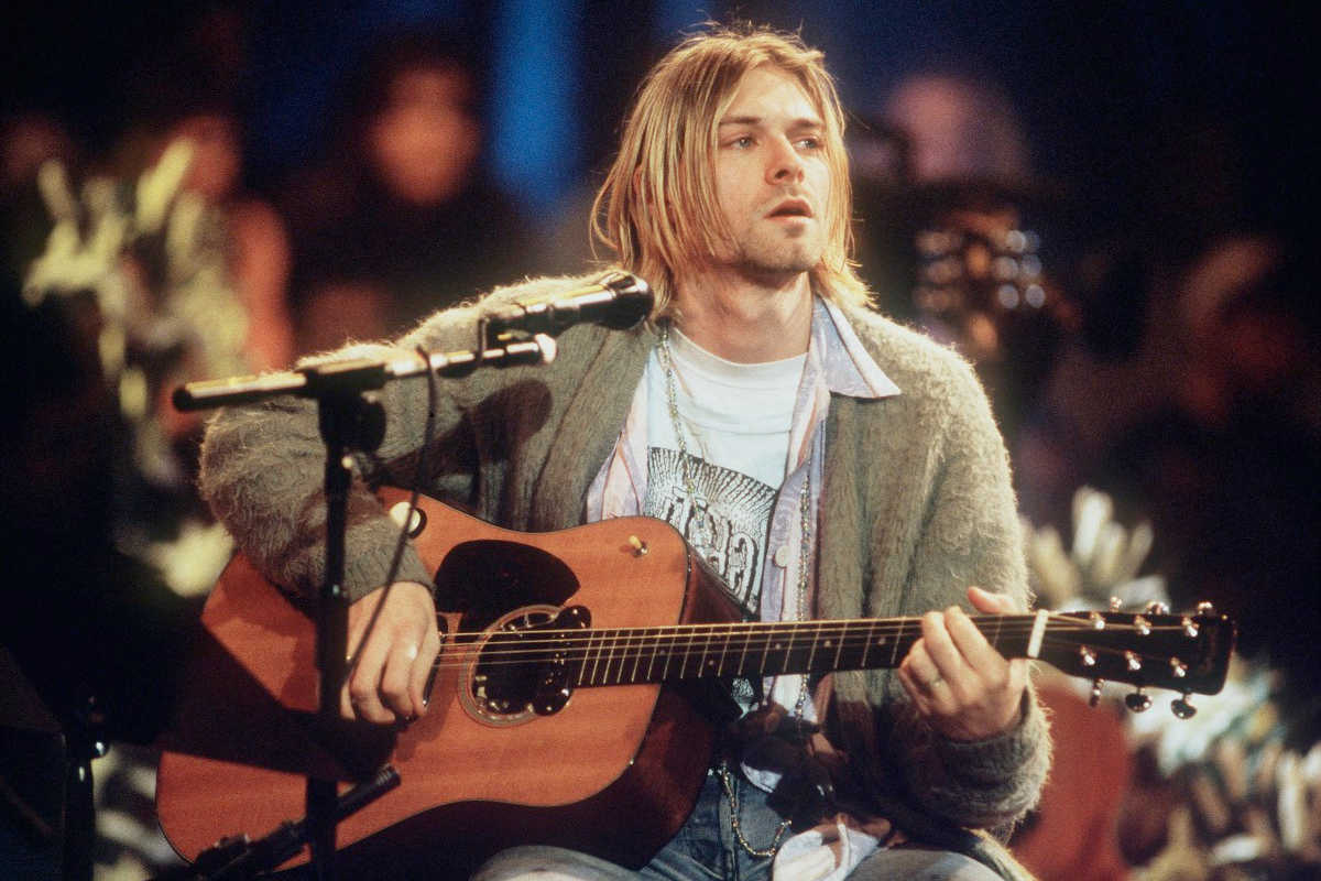 Nirvana's lead singer, Kurt Cobain, playing guitar at the MTV Unplugged In New York special