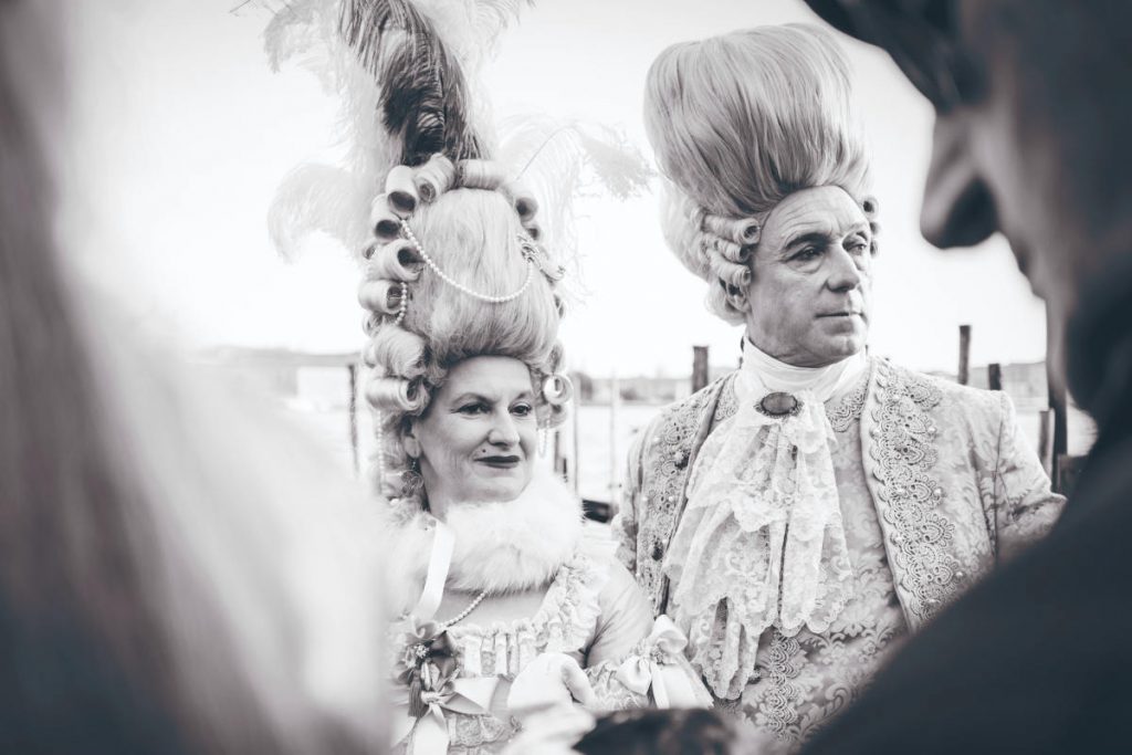 B&W picture of a couple dressed in macaroni fashion